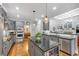 Modern kitchen with stainless steel appliances, granite countertops, and a center island, great for cooking at 102 Rosebury Dr, Canton, GA 30115