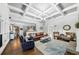Open concept living room flowing into kitchen featuring hardwood floors and fireplace at 102 Rosebury Dr, Canton, GA 30115