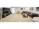 Large, open living room with carpet flooring, dark leather furniture and a TV area at 102 Rosebury Dr, Canton, GA 30115