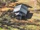 Aerial view of a small outbuilding located in a wooded area at 102 Rosebury Dr, Canton, GA 30115