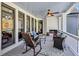 Cozy covered patio featuring a fireplace, comfortable seating, and stylish decor for relaxation at 102 Rosebury Dr, Canton, GA 30115