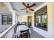 Inviting outdoor patio with a dining table, grill, ceiling fan, and serene atmosphere at 102 Rosebury Dr, Canton, GA 30115