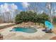 Backyard featuring a pool, waterfall, hot tub and patio at 102 Rosebury Dr, Canton, GA 30115