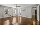 Large primary bedroom with hardwood floors, ceiling fan, and natural light at 1205 Club Walk Ne Dr, Atlanta, GA 30319