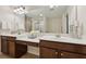 Bathroom with double sink vanity, large mirror, and modern fixtures at 220 Ashley Se Ln # 19, Smyrna, GA 30080