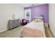 Cozy bedroom featuring a single bed and purple accent wall at 220 Ashley Se Ln # 19, Smyrna, GA 30080
