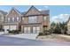Two-story brick home with a two-car garage, manicured landscaping, and a welcoming front entrance at 220 Ashley Se Ln # 19, Smyrna, GA 30080