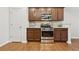 Modern kitchen features stainless steel appliances, ample cabinet space, and hardwood floors at 220 Ashley Se Ln # 19, Smyrna, GA 30080