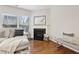 Inviting living room showcases hardwood floors, a fireplace, and a stylish seating area with a window view at 220 Ashley Se Ln # 19, Smyrna, GA 30080