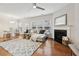 Bright living room features hardwood floors, a fireplace, and modern decor with ample natural light at 220 Ashley Se Ln # 19, Smyrna, GA 30080
