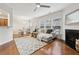Bright living room features hardwood floors, a fireplace, and modern decor with ample natural light at 220 Ashley Se Ln # 19, Smyrna, GA 30080