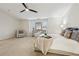 Spacious main bedroom with a ceiling fan, windows, and neutral carpet at 220 Ashley Se Ln # 19, Smyrna, GA 30080