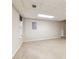 Unfinished basement featuring neutral carpet, a window, and recessed lights at 2650 Westbury Ct, Suwanee, GA 30024