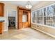 Breakfast nook featuring built-in cabinetry, laundry area, and a window with views of a wooded lot at 2650 Westbury Ct, Suwanee, GA 30024