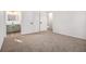 This spacious bedroom has carpet flooring, a closet, and is adjacent to the bathroom at 594 Waynes Se Ct, Atlanta, GA 30354