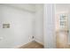 An empty closet with white walls, vinyl flooring, and shelving for storage at 594 Waynes Se Ct, Atlanta, GA 30354