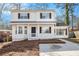 Charming two-story home featuring a welcoming front porch and manicured lawn at 594 Waynes Se Ct, Atlanta, GA 30354