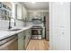 Well-lit kitchen features stainless steel appliances, modern countertops, and ample storage at 594 Waynes Se Ct, Atlanta, GA 30354