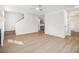Open-concept living room with hardwood floors and staircase access at 594 Waynes Se Ct, Atlanta, GA 30354