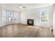 Spacious living room featuring a fireplace, large windows, and ample natural light at 594 Waynes Se Ct, Atlanta, GA 30354
