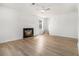 Bright living room boasts hardwood floors and a cozy fireplace, perfect for relaxing at 594 Waynes Se Ct, Atlanta, GA 30354