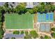 Aerial view showcasing a soccer field, sports courts, parking, and lush greenery at 799 Hammond Dr # 305, Atlanta, GA 30328