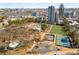 Aerial view of community featuring recreational facilities, sports fields, and city skyline at 799 Hammond Dr # 305, Atlanta, GA 30328