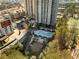 Aerial view showcasing the pool, playground, community grills and high-rise buildings at 799 Hammond Dr # 305, Atlanta, GA 30328