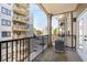 Relaxing balcony with railings, offering fresh air and a view of neighboring buildings at 799 Hammond Dr # 305, Atlanta, GA 30328