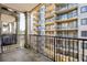 Balcony offers a relaxing space with a view of surrounding buildings and a glimpse of the city skyline at 799 Hammond Dr # 305, Atlanta, GA 30328