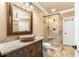 Stylish bathroom features a stone sink, walk-in shower, and tile flooring at 799 Hammond Dr # 305, Atlanta, GA 30328
