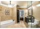 Stylish bathroom boasting decorative tile, modern lighting, and convenient access to the bedroom at 799 Hammond Dr # 305, Atlanta, GA 30328