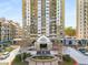 Attractive condominium building exterior with well maintained grounds, water feature, and covered entrance at 799 Hammond Dr # 305, Atlanta, GA 30328