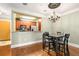 This dining area features an elegant chandelier and a convenient pass-through to the kitchen at 799 Hammond Dr # 305, Atlanta, GA 30328