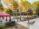 Community grill area featuring built-in grills and fire pit, perfect for outdoor entertaining at 799 Hammond Dr # 305, Atlanta, GA 30328