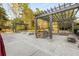 Community grill area with stone counters, built-in gas grill and seating, ideal for gatherings at 799 Hammond Dr # 305, Atlanta, GA 30328