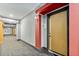 Well-lit building hallway with carpeted floor and fire-safety features at 799 Hammond Dr # 305, Atlanta, GA 30328