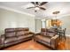 This living room has hardwood floors, crown molding, and access to the dining room at 799 Hammond Dr # 305, Atlanta, GA 30328