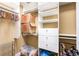 Organized walk-in closet with shelves, drawers, and hanging rods provides ample storage space at 799 Hammond Dr # 305, Atlanta, GA 30328