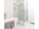 Close up of glass enclosed shower stall with light patterned tile, with soaking tub and a modern faucet at 1931 Amber Dawn Way, Lawrenceville, GA 30043