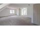 Large bonus room features carpet, ceiling fan, skylight, and barn door at 1931 Amber Dawn Way, Lawrenceville, GA 30043