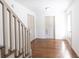 Hallway showcasing hardwood floors and neutral paint with white doors and trim at 1931 Amber Dawn Way, Lawrenceville, GA 30043