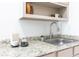 Close up on a kitchen sink with granite countertop, a stylish faucet, and neutral cabinets at 1931 Amber Dawn Way, Lawrenceville, GA 30043