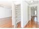 Pantry in hallway with hardwood floors and shelving at 1931 Amber Dawn Way, Lawrenceville, GA 30043