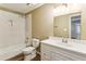 Bathroom featuring a tub with white subway tile surround and a white vanity at 2701 Cumberland Se Ct, Smyrna, GA 30080