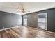 Spacious primary bedroom with wood flooring, ceiling fan, and two large windows at 2701 Cumberland Se Ct, Smyrna, GA 30080