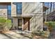 Condo entrance showcasing two front doors with painted exteriors and manicured landscaping at 2701 Cumberland Se Ct, Smyrna, GA 30080