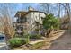 Multi-level condo building with private balconies and stairs leading to the landscaped grounds at 2701 Cumberland Se Ct, Smyrna, GA 30080