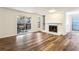 Bright living room featuring wood floors, a fireplace, and sliding glass doors to a deck at 2701 Cumberland Se Ct, Smyrna, GA 30080