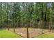 Fenced garden area in wooded back yard at 2170 Leguin Mill Rd, Locust Grove, GA 30248